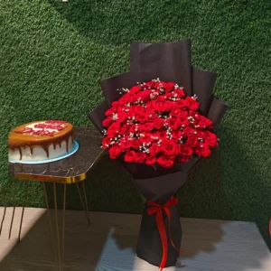 Grand 50 red roses bouquet in black wrap paired with a caramel drip birthday cake
